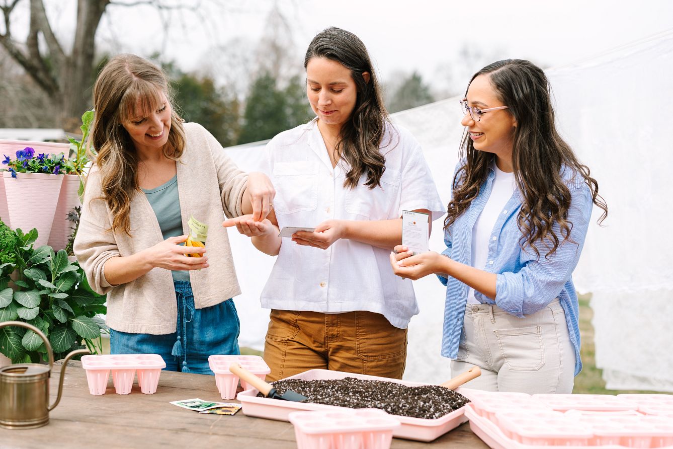 Women swapping seeds together