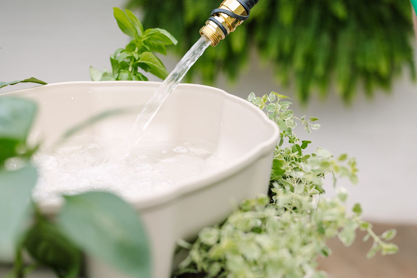 Watering a GreenStalk Vertical Planter through the top water reservoir